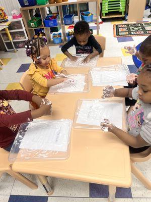 Children engaged using worksheets and "reusable learning mats", making them suitable for repeated practice.