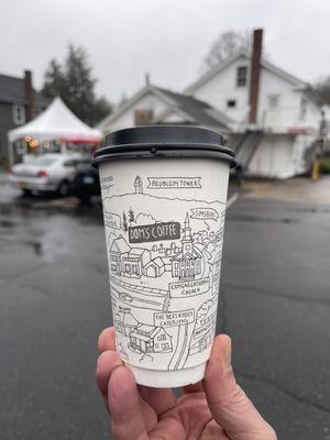 Cappuccino, cool artwork on their cups, a cartoonish map of the area