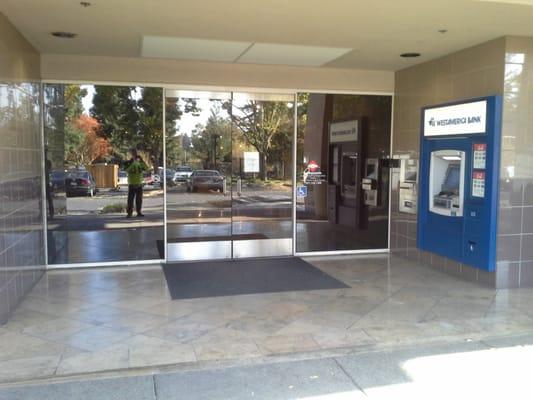 Entrance to building and atm.