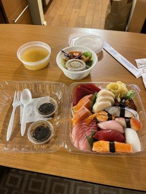 Sashimi, maki, miso soup, and salad