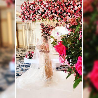 Capturing the essence of love and beauty, our bride poses amidst the stunning floral decor at her wedding ceremony. 

Visit dipali.com