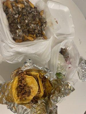 Carne Asada fries and Al pastor tacos