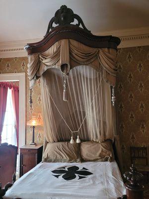 Period accurate bed clothes including mosquito net used to protect from the transmission of yellow fever.