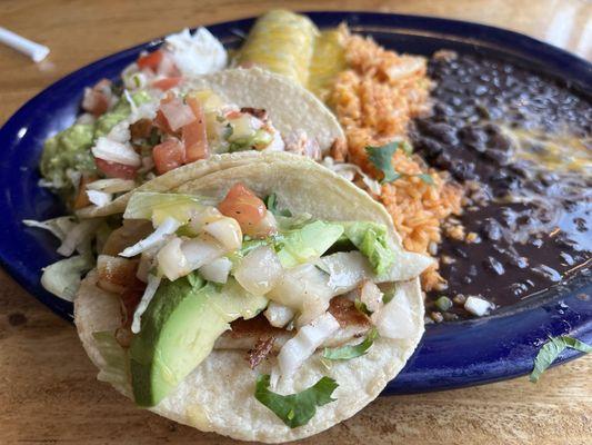 Combo platter of chicken taco, fish taco and chicken enchilada