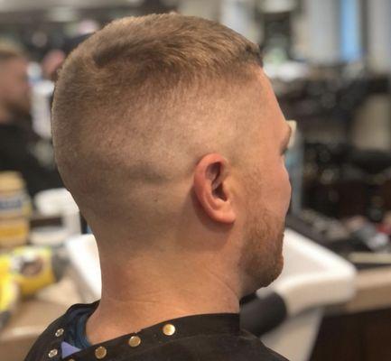 Mid/high bald fade and beard trim with a line up