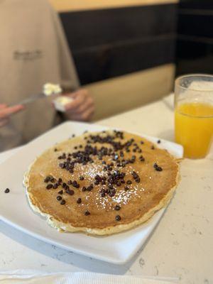 Chocolate chip pancake and freshly squeezed orange juice