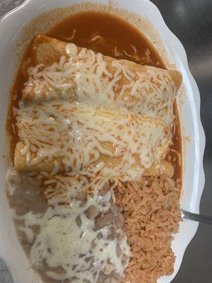 Chicken enchiladas with rice and beans