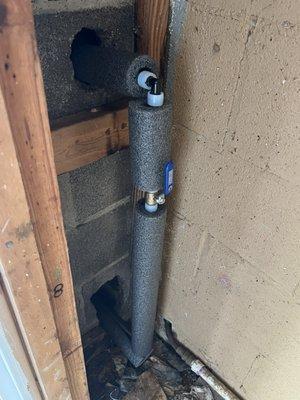 New piping and shut-off valve for outside spigot where old piping was burst.