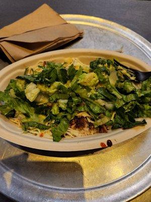 Chicken bowl, black beans, rice, guacamole, hot salsa, cheese, corn and lettuce....Mostly rice/lettuce