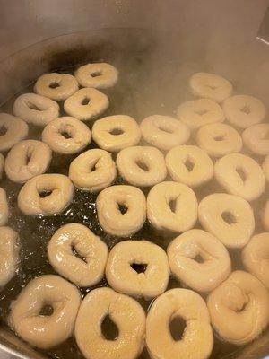 Boiling bagels fresh every day