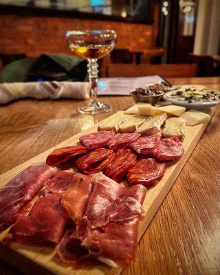 Charcuterie board and a Manhattan.