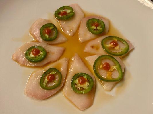 Yellowtail jalapeño appetizer.  Yummy, but still don't understand why the ponzu is so watered down.