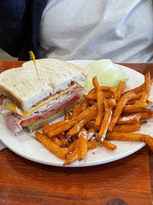 1/2 of my wife's sandwich, the white on the fries is like a delicious ranch like powder. Yum.