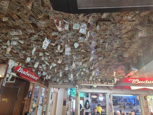 Ceiling at Baxas. All $1 bills.