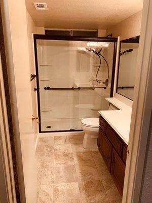 Bathroom remodel.. TileShower doors , Toilet