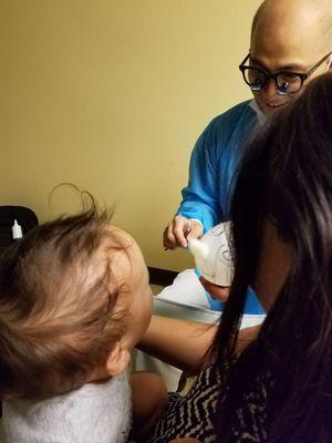 Doc giving the kid a balloon animal.  Everyone was fantastic with our little guy.  We are so glad to have him as our dentist.