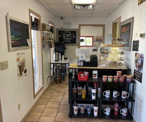 Front counter, baked goods, swag.