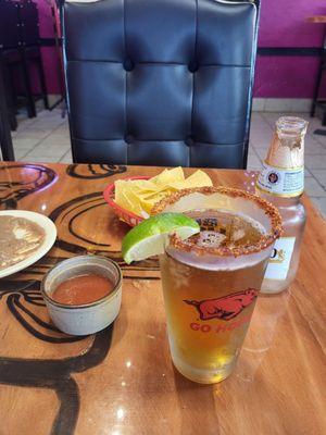 Modelo w/ lime and frosted cold glass w tajin rim. Chips & salsa and refried beans!