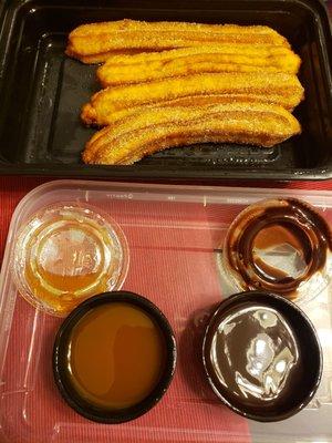 Churros with caramel and chocolate sauces