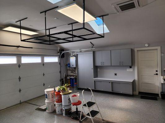 Sliding cabinets and terrarium counter. Overhead storage rack.