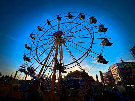 The Ferris wheel at sunset!! One of the many carnival rides at Peach Days!