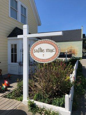 Store signage in the entry garden