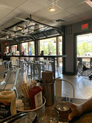 View of some tables and opening leading to outdoor tables