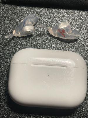 Next to airpods for size reference