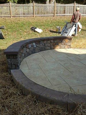 Small patio with Stone wall and Concrete top.