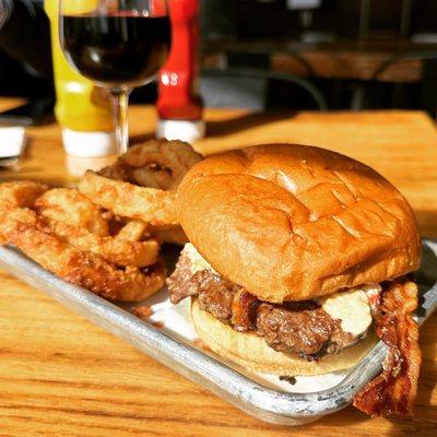 Burger with bacon and pimento cheese and onion rings