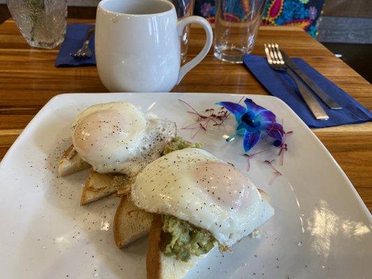 Avocado Toast with tomato and 5-minute eggs. Delicious guac, eggs just right, and nice quality bread. Nice touch on the presentation too!