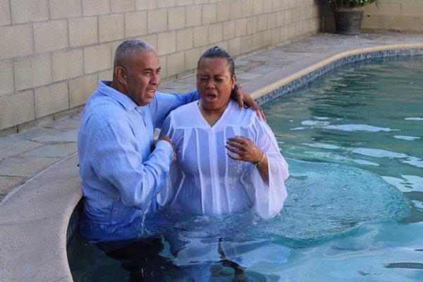 Baptism in water by the Lead Pastor