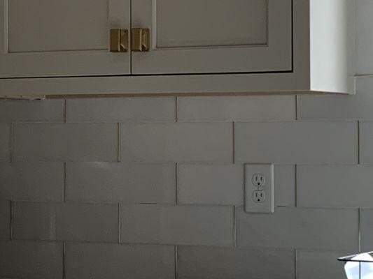 Graham white marble backsplash with gold edging