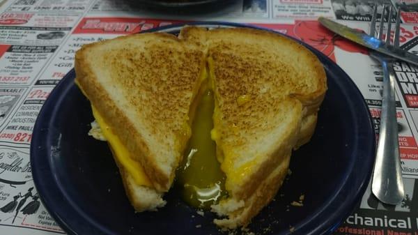 Toasted cheese sandwich with egg.