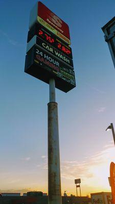 the high-rise sign visible from a distance showing the services gas and diesel price.. Dunkin Subway & 24-hour gambling machines