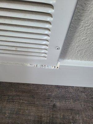 I am not sure what is going on here. They cut around the vent but obviously did a terrible job and painted over it.