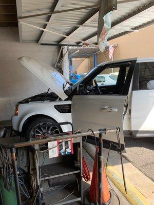 Car getting smog check.