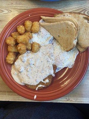 Spicy chicken fried chicken with spicy gravy and perfectly crispy tots