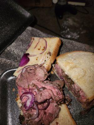 beef tenderloin with red onion on toasted white bread