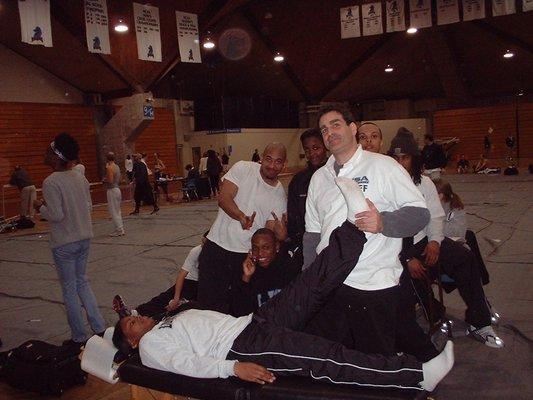 Dr. Charschan working with runners at a USATF NJ track event