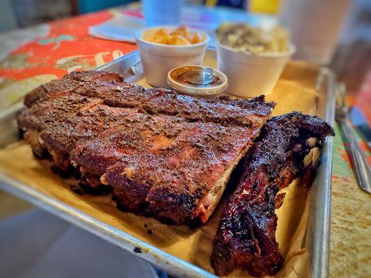 Half rack of ribs with potato salad and Mac and cheese