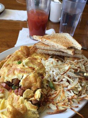 Western omelette, hash browns, rye toast and a Bloody Mary.