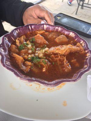 Menudo with onion and cilantro