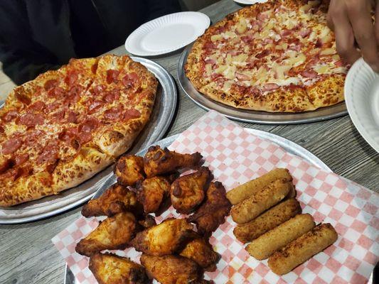 XL Pepperoni Pizza, chicken wings XL Pineapple Pizza, mozzarella sticks, chicken wings, and our appetite!