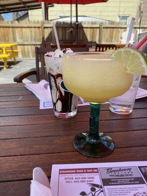 Frozen margarita and frozen dirty banana daiquiri in the back