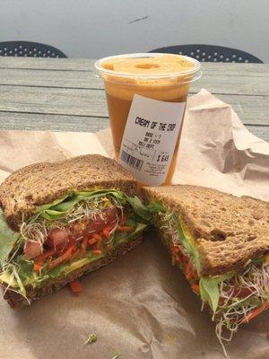 Veggie sandwich and carrot orange juice