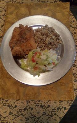 Veal cutlet, dirty rice and salad.