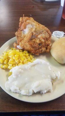 Fried chicken Potatoes gravy and corn.