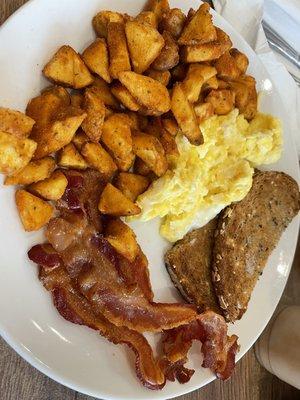 Scrambled Eggs, Bacon, whole grain buttered toast & bacon