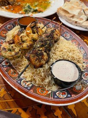 Shrimp and chicken kabob over rice